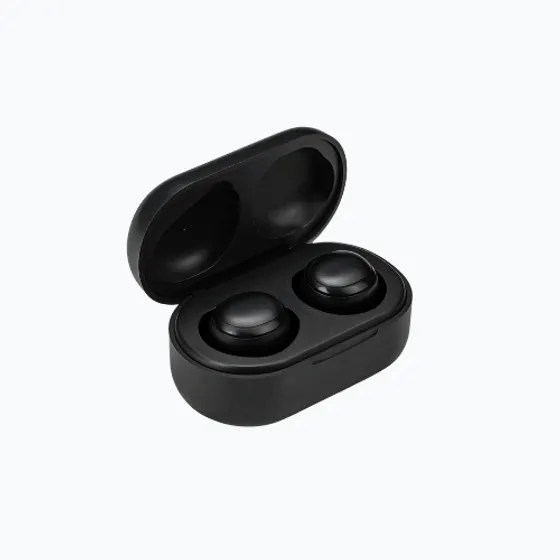 A pair of black true wireless earbuds in an open charging case